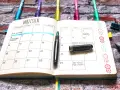 Bullet journal pomysły na strony: kalendarz na wrzesień z notatkami o szkole i festiwalu.